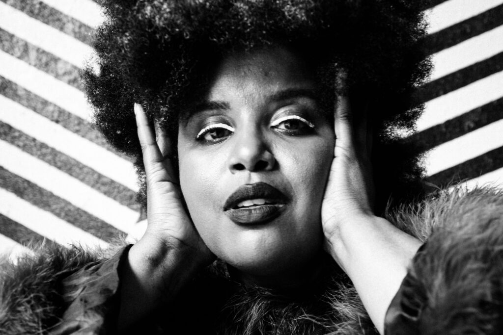 “The Truth as the Mission”: The Suffers’ Kam Franklin Puts Trauma, Desire, & Defiance on the Record with ‘Land of the Neon Sun,’ Her Uncompromising Solo Debut